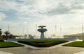 View from the window of a tourist bus in the rays of the setting sun on a decorative fountain in the roundabout square in Abu