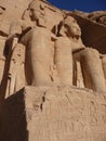 Statues depicting Ramses II seated on a throne wearing the double crown of Upper and Lower Egypt Royalty Free Stock Photo