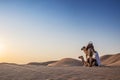 ABUDHABI/UAE - 13DEZ2018 - Camels in the desert of Abu Dhabi with their trainer. UAE