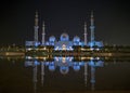 A night view of Sheikh Zayed Grand Mosque from a water reflectio
