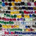 An abundance of colorful and shiny glass pebbles arranged as a captivating and vibrant background