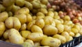 Fresh potatoes in crates on market stall Royalty Free Stock Photo