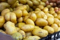 Fresh potatoes in crates on market stall Royalty Free Stock Photo