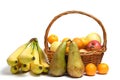 Abundance fruits white background in wicker basket, apples, pears, citrus fruits and bananas
