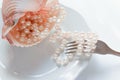 The abundance of life - precious necklace of pink pearls in the dish of destiny. Luxury lifestyle Royalty Free Stock Photo
