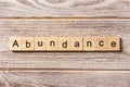 Abundance word written on wood block. abundance text on table, concept Royalty Free Stock Photo