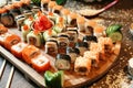 Abundant Assortment of Sushi on Wooden Plate