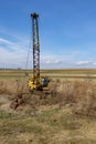 Abundant old, rusty mobile crane left on field.