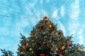 Abundantly Decorated Christmas Tree At Sunny Bright Winter Day Before New Year. Christmas European Fair