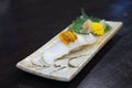 Aburi engawa sushi - Grilled flatfish (Fluke fin) on rice topping with fresh uni served with pickled ginge