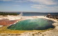 Abyss Pool in the West Thumb Geyser Basin,forest and sky as background Yellowstone National Park, reflections,morning,WY,USA Royalty Free Stock Photo