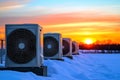 AC Units Winter Sunset Scene Winter sunset scene featuring multiple AC units on a snowy rooftop Symbolizing efficiency Royalty Free Stock Photo