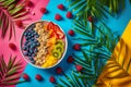 Aca fresh fruit bowl - top view shot - colorful background with leaves and fruit