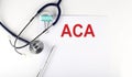 ACA text written on the paper with a stethoscope. Medical concept Royalty Free Stock Photo