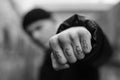 ACAB tattoo on the arm of a bully man. Black and white photo Royalty Free Stock Photo