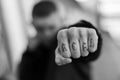 ACAB tattoo on the arm of a bully man. Black and white photo Royalty Free Stock Photo