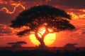 Acacia tree silhouette, rocks and plain grassland field against a setting sun. African savannah sunset landscape Royalty Free Stock Photo