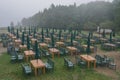 Acadia National Park, Maine, USA: Rows of tables and benches and folded umbrellas on a lawn Royalty Free Stock Photo