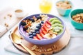 acai berry detox smoothie bowl, assorted nuts topping Royalty Free Stock Photo