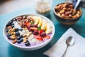 acai berry detox smoothie bowl, assorted nuts topping Royalty Free Stock Photo