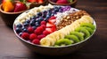 Acai bowl with strawberries, banana, blueberries, kiwi fruit, nuts and granola on wooden table. Nourishing breakfast full of Royalty Free Stock Photo