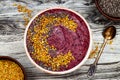 Acai breakfast superfoods smoothies bowl with chia seeds, bee pollen toppings. Immune boosting, anti inflammatory smoothie Royalty Free Stock Photo