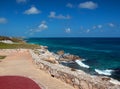 Acantilado del Amanecer Cliff of the Dawn at Punta Sur point on Isla Mujeres (island) with the Caribbean ocean in the ba Royalty Free Stock Photo