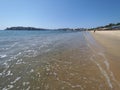 Panoramic view of sandy beach at bay of ACAPULCO city in Mexico with tourists and calm waves of Pacific Ocean Royalty Free Stock Photo