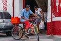 Delivery boy on bike downtown old Acapulco, Mexico Royalty Free Stock Photo