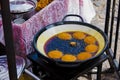 AcarajÃÂ© being fried in dende oil pan. AcarajÃÂ© is a gastronomic specialty of African and Afro-Brazilian cuisine