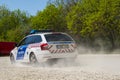 Accelerating Hungarian police car on a gravel road