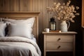 Accent bedside cabinet near bed against wood paneling wall. AI generate
