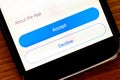 Accept and Decline buttons on smartphone app screen closeup