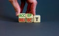 Accept or reject symbol. Businessman turns wooden cubes and changes the word reject to accept. Beautiful grey table, grey