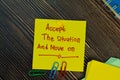 Accept the situation and move on write on sticky notes isolated on Wooden Table. Motivation concept