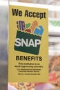 We Accept SNAP Benefits sign. SNAP and Food Stamps provide nutrition benefits to assist disadvantaged families