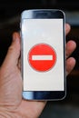 Access denied sign on smartphone screen in man hand Royalty Free Stock Photo