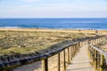 Access ocean sandy pathway fence wooden to ocean beach atlantic sea coast at talmont saint hilaire vendee France Royalty Free Stock Photo
