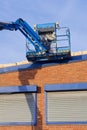 Access platform equipment powered high in sky at construction building site