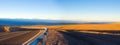 Access road and panoramic view of Atacama Salt Lake Salar de Atacama and San Pedro de Atacama Royalty Free Stock Photo