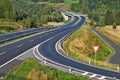 Access road to the highway between forests in the landscape Royalty Free Stock Photo