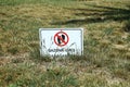 Signboard with the symbol don't walk on the grass . Road stop sign, access prohibited. Do not cross. Prohibition sign on Royalty Free Stock Photo