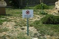 Signboard with the symbol don't walk on the grass . Road stop sign, access prohibited. Do not cross. Prohibition sign on Royalty Free Stock Photo