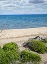 Access to the sea through natural sand dunes.Mediterranean scrub. Royalty Free Stock Photo