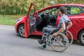 Accessibility concept. Handicapped or disabled man on wheelchair near car