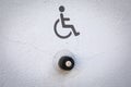 Accessibility Doorbell Button with Wheelchair Symbol Sign Royalty Free Stock Photo