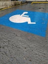 Accessibility parking spot on the wet asphalt