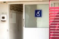 Public restroom signs with a disabled access symbol