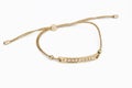 Gold bracelet on white background Royalty Free Stock Photo