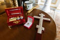Accessories for the baptism of a child in the church. Cross. holy light. Box with essential oils. Holy water. Evangelia